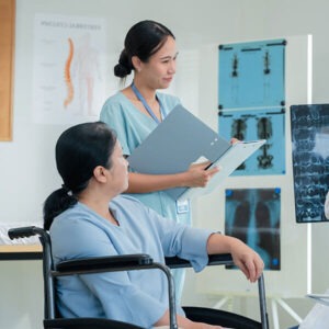 Medical professional discussing treatment options with a patient in a clinical setting, emphasizing personalized care and wellness services at Skin & Body Med Spa.