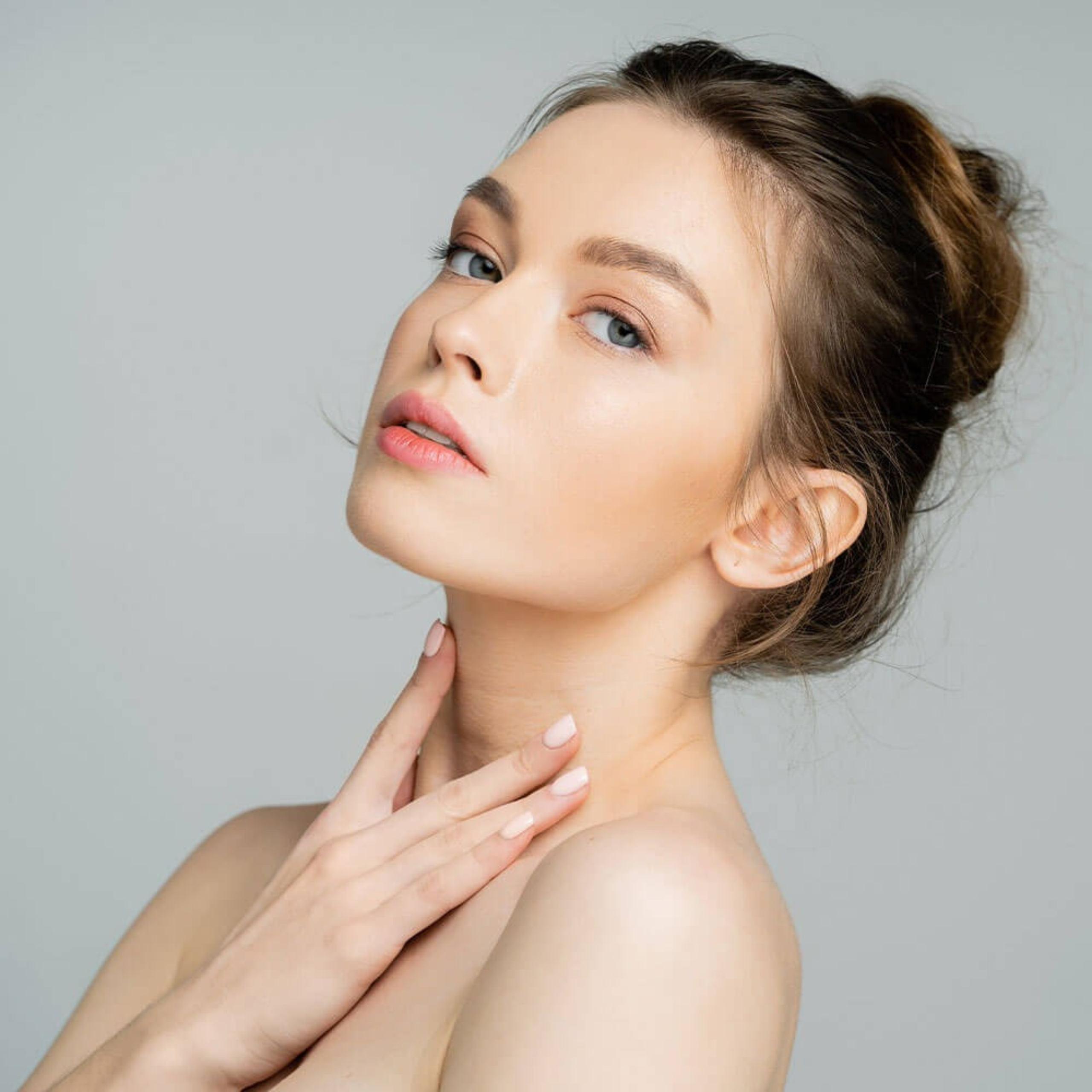 Young woman with glowing skin and a natural makeup look, showcasing aesthetic beauty and wellness, reflecting Skin & Body Med Spa's commitment to transformative care.