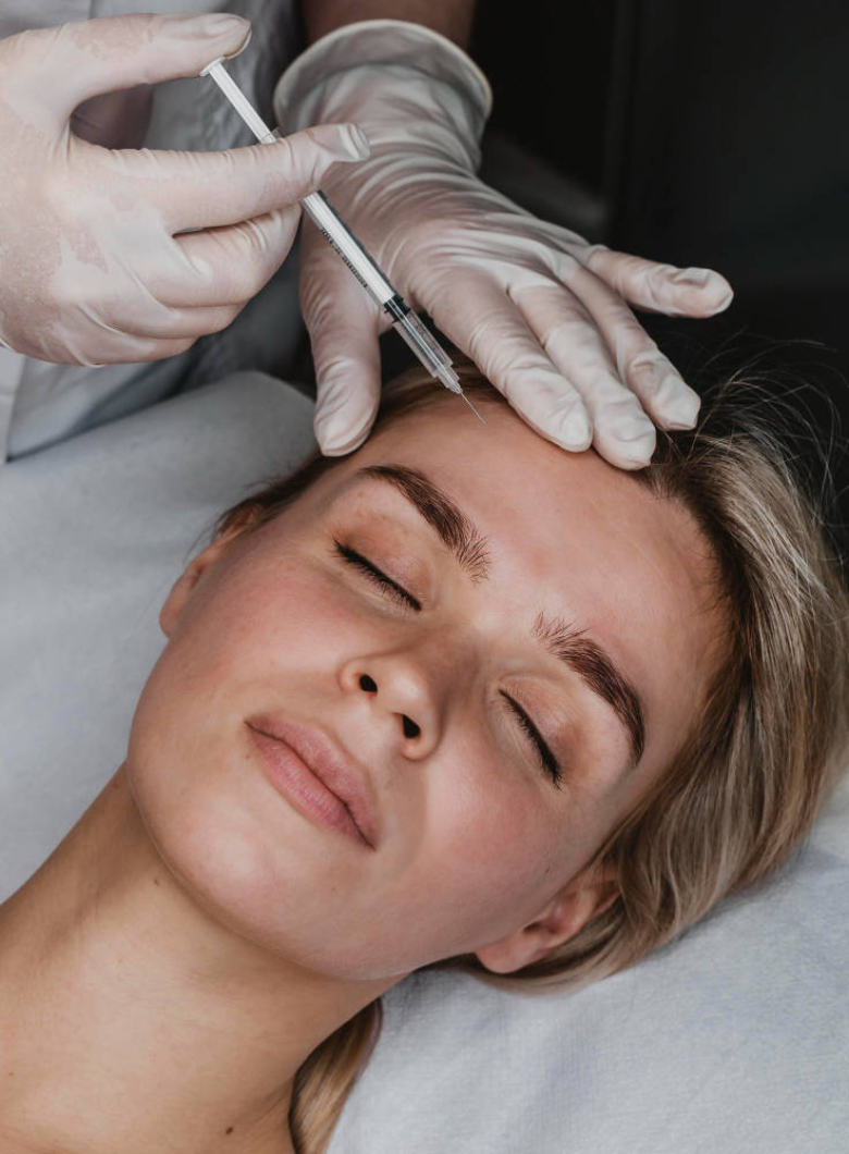 Woman receiving Botox treatment, medical professional administering injection, focus on aesthetic enhancement and wellness.